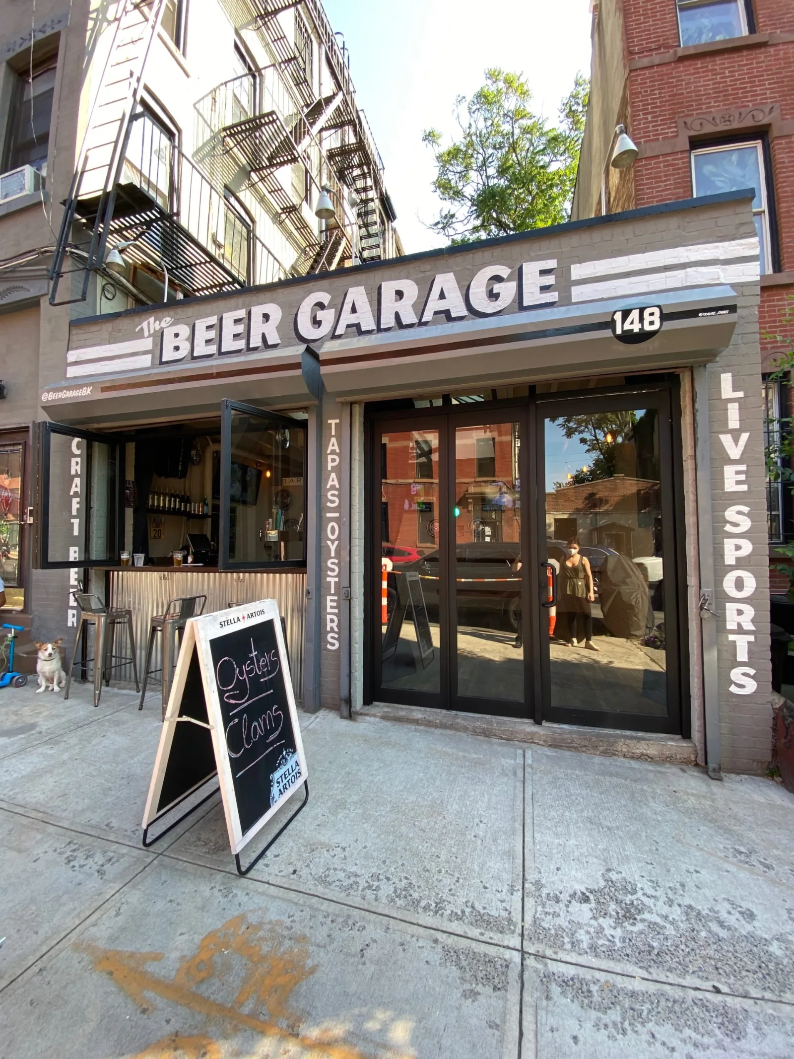 The Beer Garage storefront at 148 5th Avenue in Park Slope, with Live Sports painted beside the doors, eight minutes from Barclays Center, where you can watch NBA in New York on a Nets night